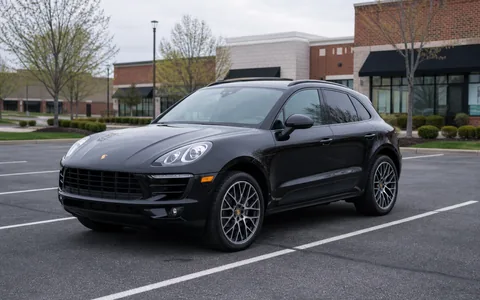 Black Porsche Macan parked in a Midwest parking lot